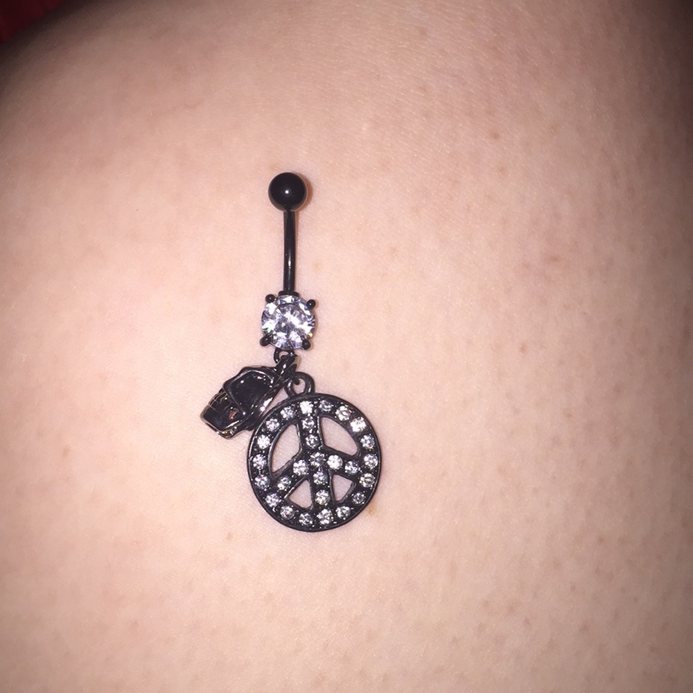 Peace sign and skull belly ring